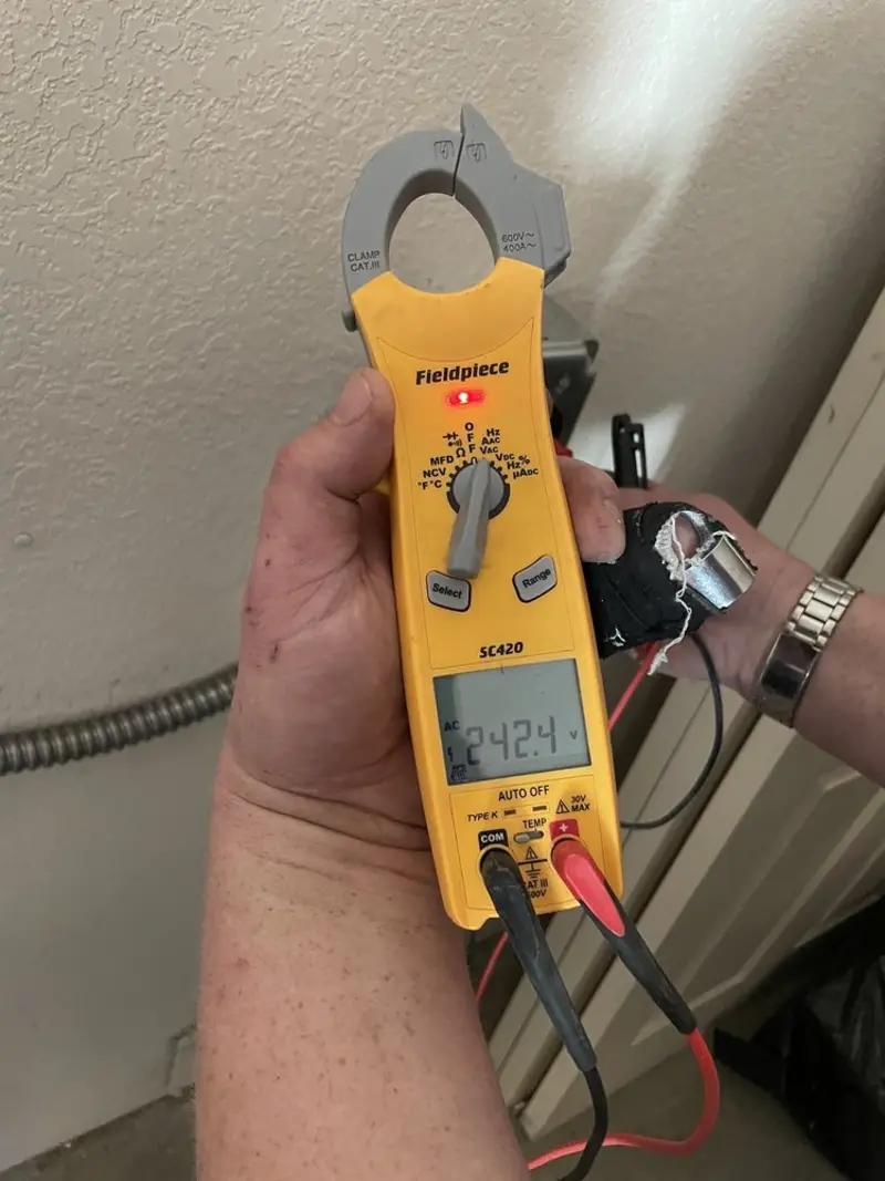 Voltage testing with clamp meter during Whole House Surge Protector in Chester